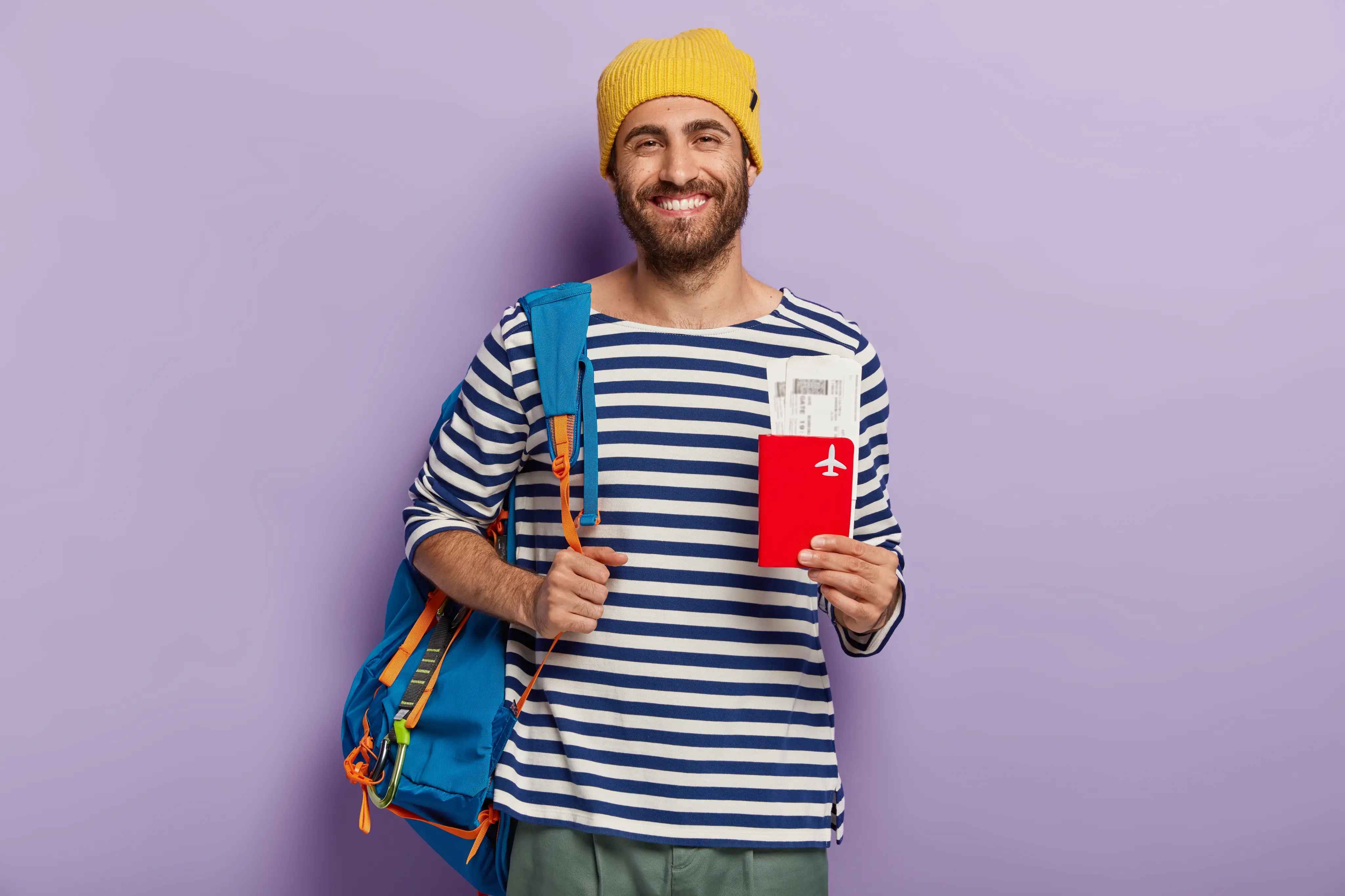 A prospective student traveller holding a passport and boarding passes